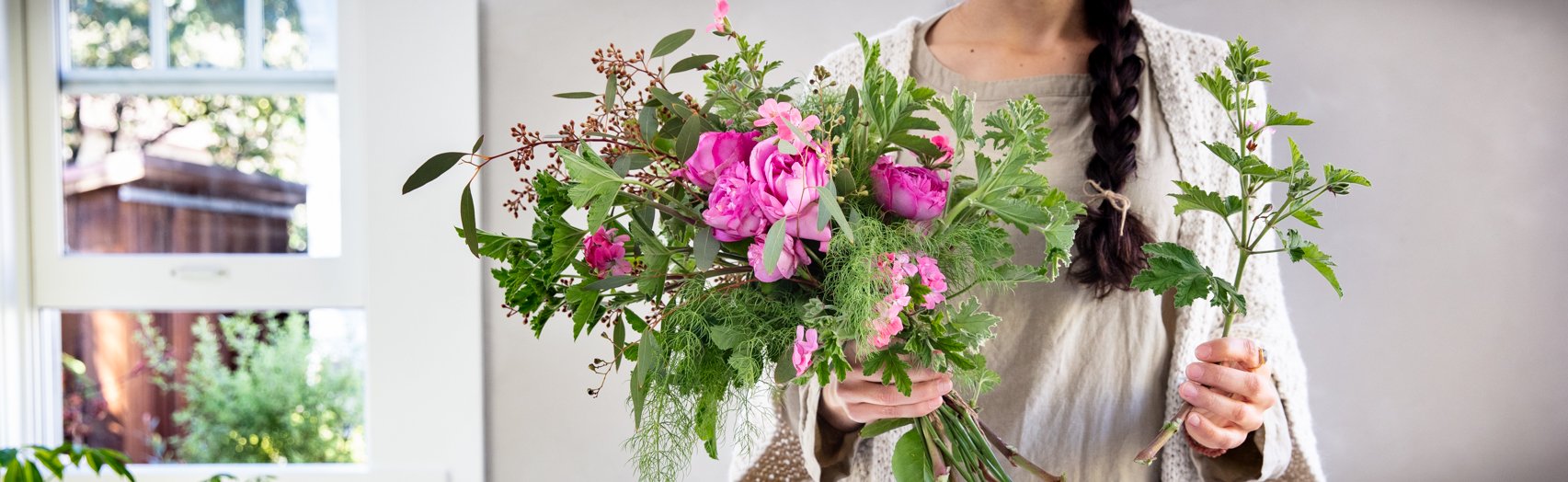 Woman holding herbal bouquet