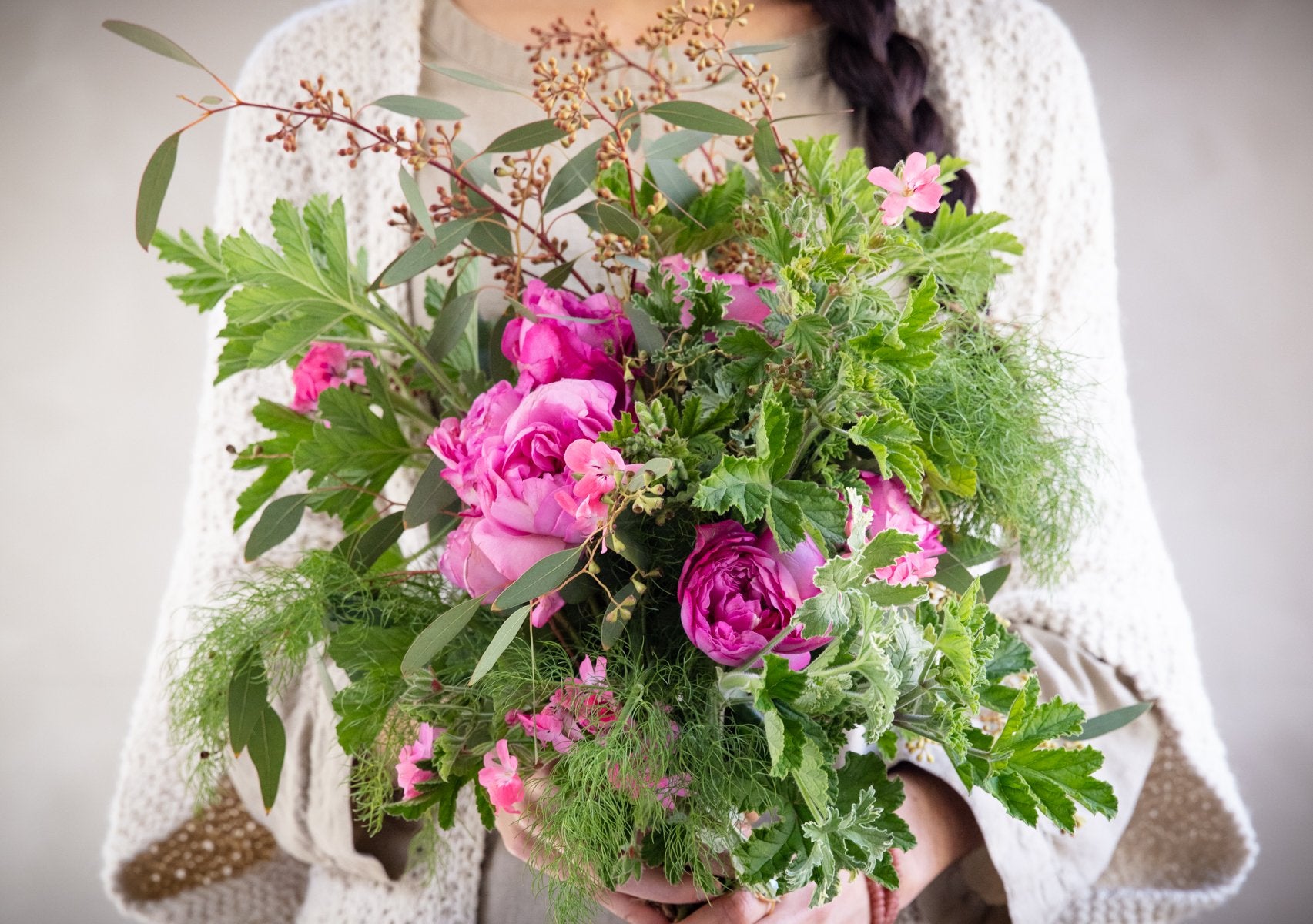 Woman holding herbal bouquet 