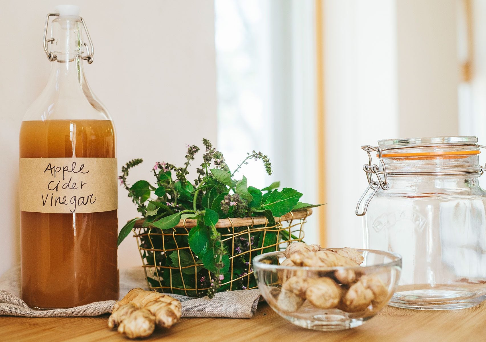 Kitchen counter with jar full of Tulsi & Ginger Apple Cider Vinegar Tonic