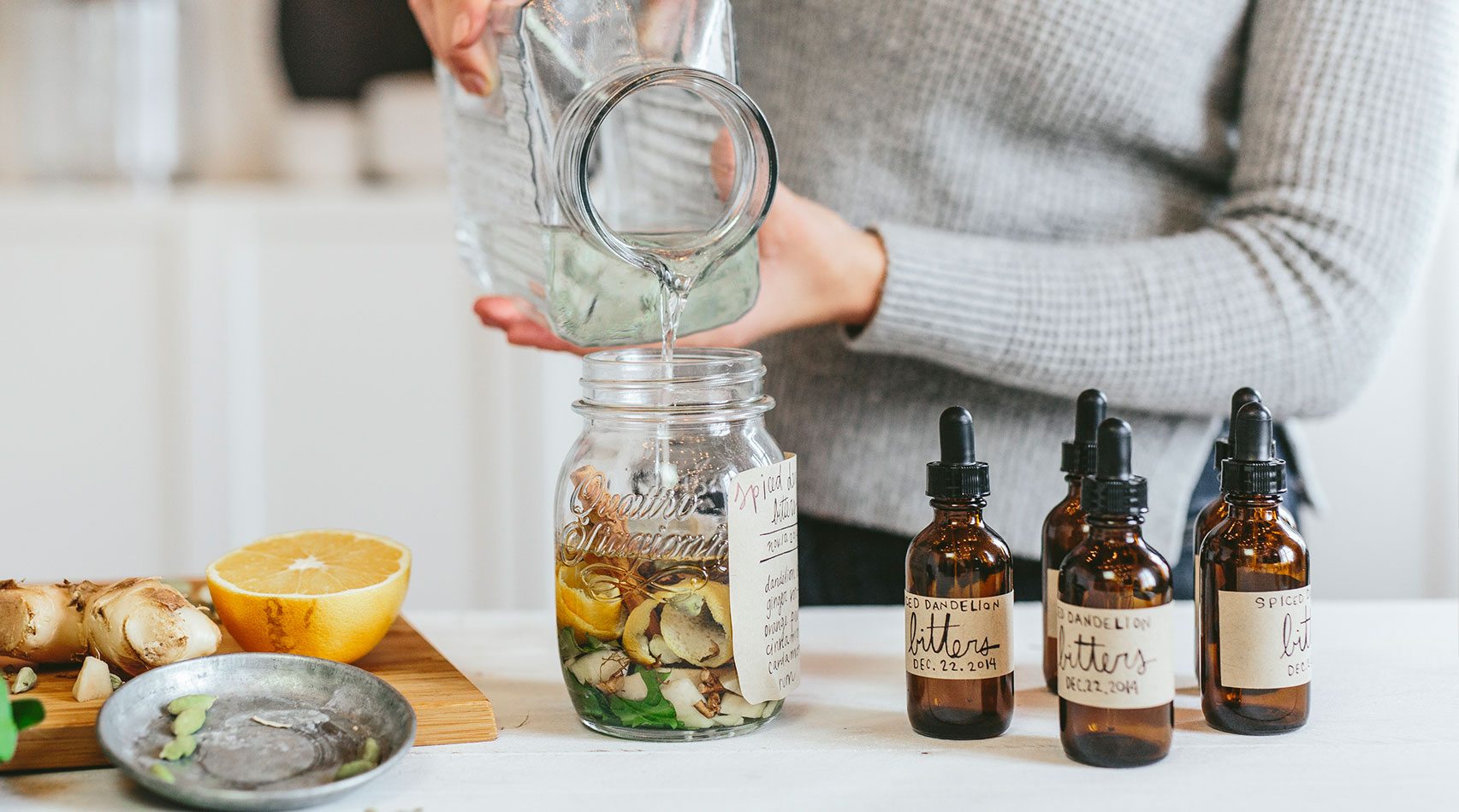 pouring oil into jar