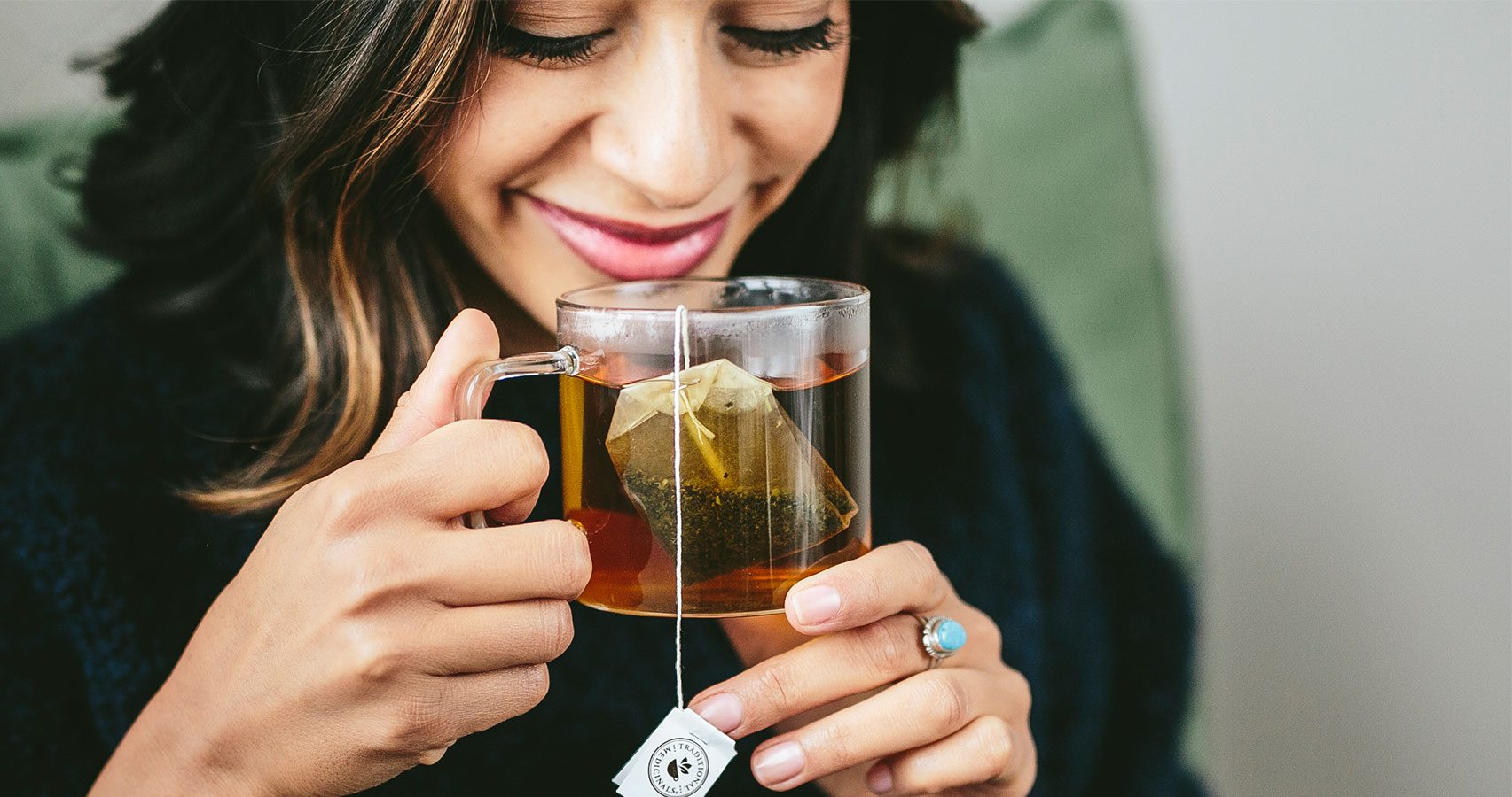 woman enjoying lemon balm tea